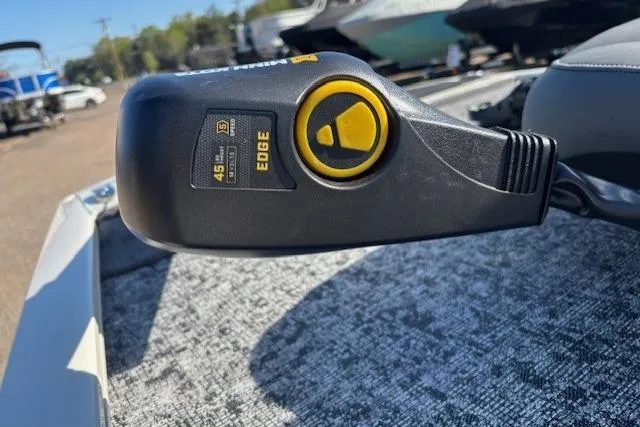 Slide: The Image of Close-up of a 2026 Tracker Pro 170 boat control lever on a textured surface. - 12