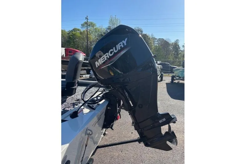 Slide: The Image of 2026 Tracker Pro 170 boat with Mercury outboard motor in a sunny outdoor setting. - 3