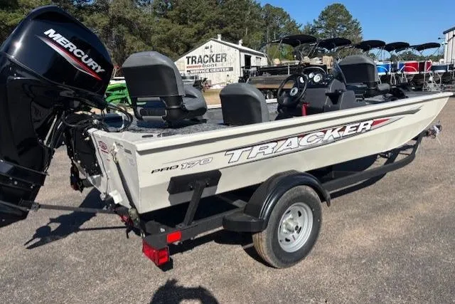 Slide: The Image of 2026 Tracker Pro 170 boat with Mercury engine on trailer, parked outdoors. - 5