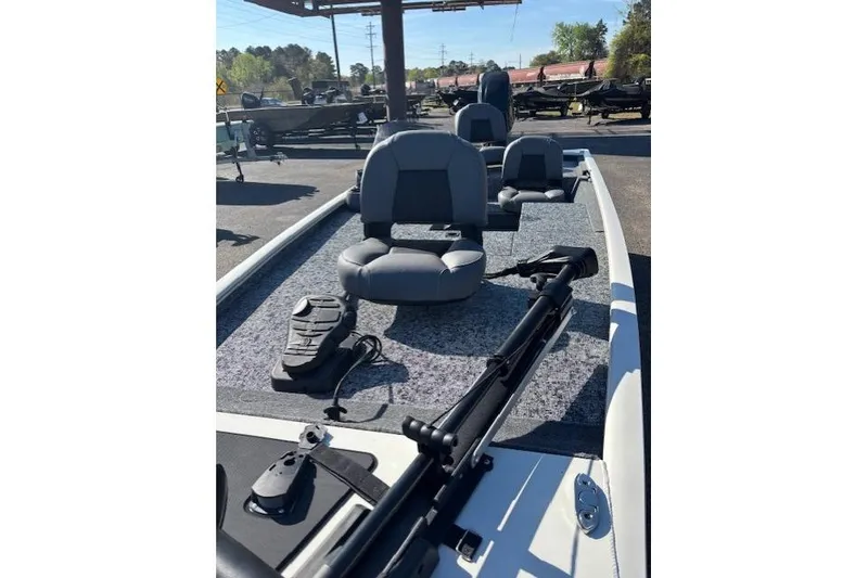 Slide: The Image of 2026 Tracker Pro 170 boat with gray seating and fishing equipment on deck. - 8