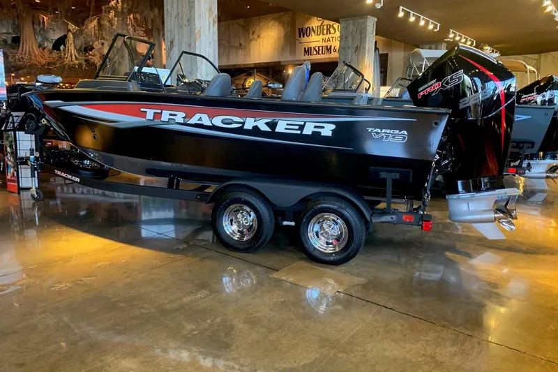 The Image of 2026 Tracker Targa V-19 Combo boat displayed indoors on a trailer. - 0