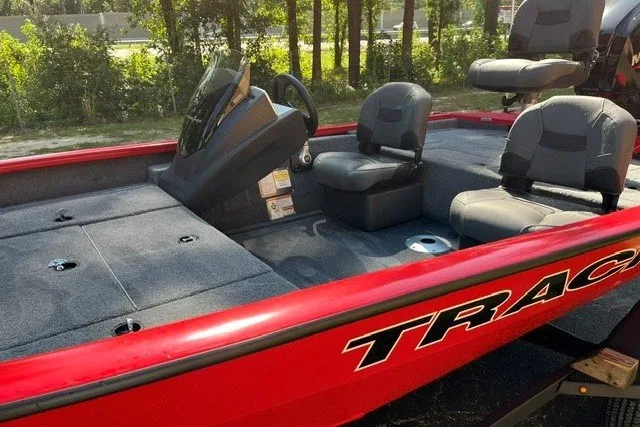 Slide: The Image of 2026 Tracker Pro Team 175 Crappie Edition boat with red exterior and seating. - 14