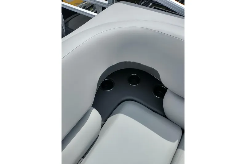 Slide: The Image of 2026 Sun Tracker SportFish 20 DLX boat seating with integrated cup holders. - 21