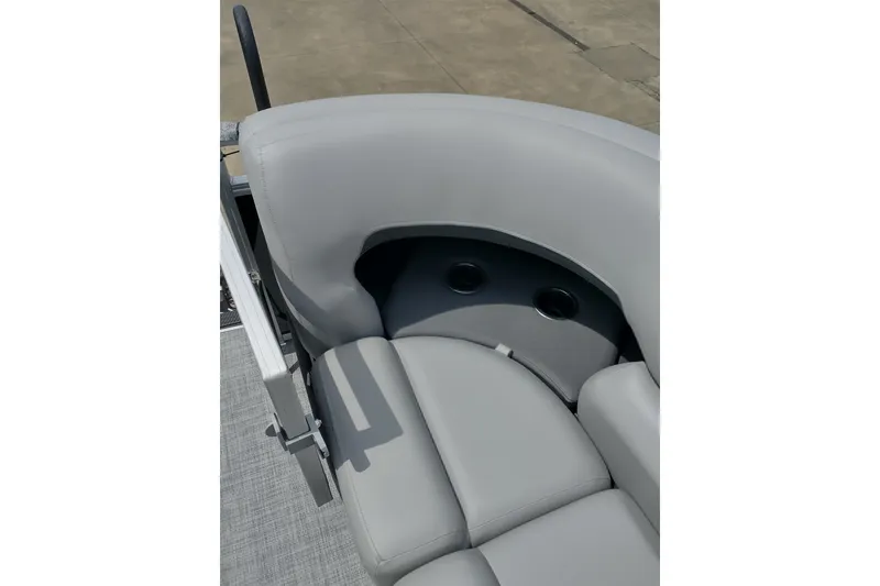 Slide: The Image of 2026 Sun Tracker SportFish 20 DLX boat with gray cushioned seating and cup holders. - 22