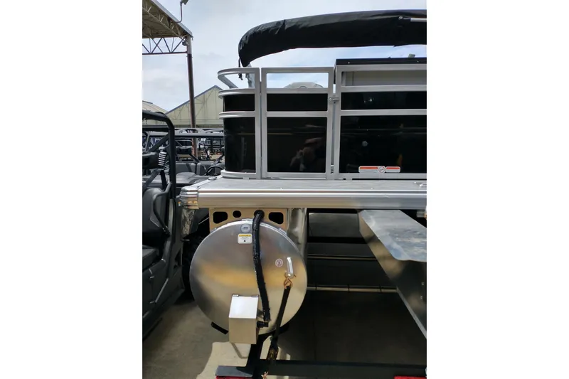 Slide: The Image of 2026 Sun Tracker SportFish 20 DLX pontoon boat, rear view with aluminum structure. - 4