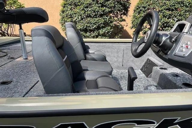 Slide: The Image of 2026 Tracker Pro Team 195 boat interior with gray seating and steering wheel. - 5