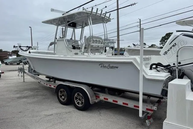 The Image of 2024 Pair Customs 27 Center Console boat on trailer, side view. - 0