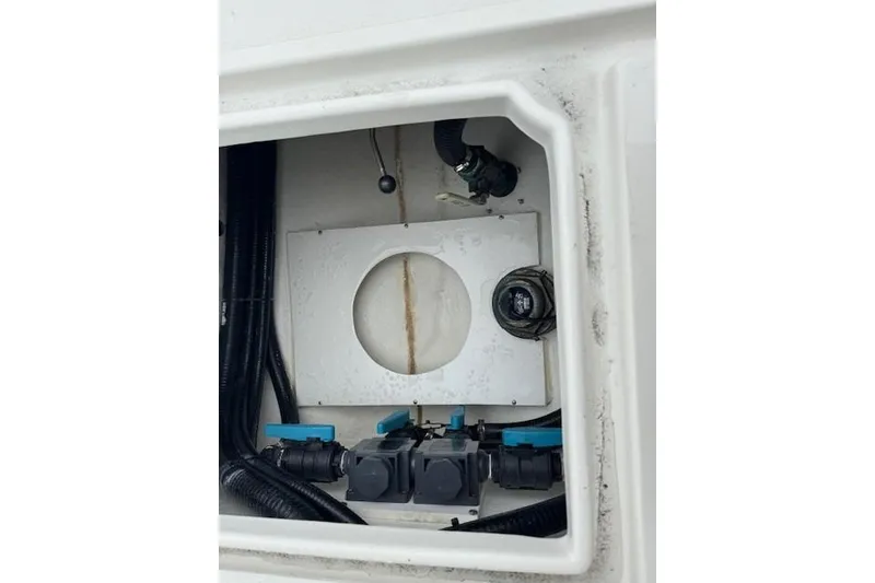 Slide: The Image of 2024 Pair Customs 27 Center Console interior wiring and components view. - 10