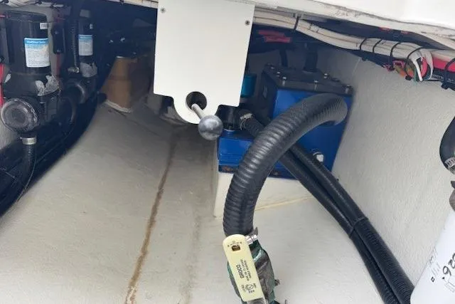 Slide: The Image of 2024 Pair Customs 27 Center Console boat interior with visible wiring and components. - 9