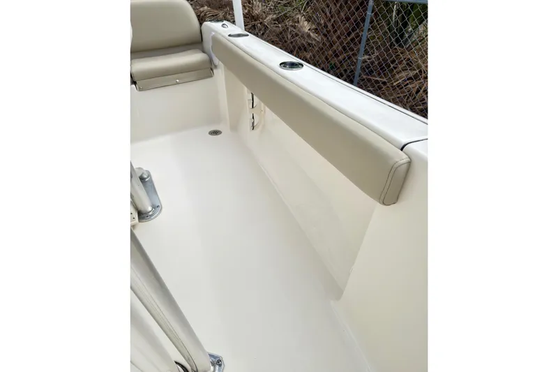 Slide: The Image of Interior view of 2023 Key West 189 FS boat, featuring beige seating and stainless steel fixtures. - 11