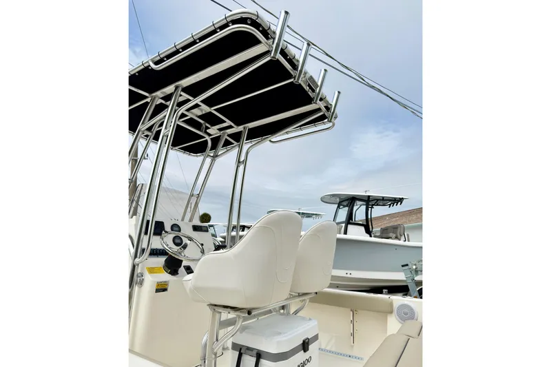 Slide: The Image of 2023 Key West 189 FS boat interior with steering console and seating. - 8