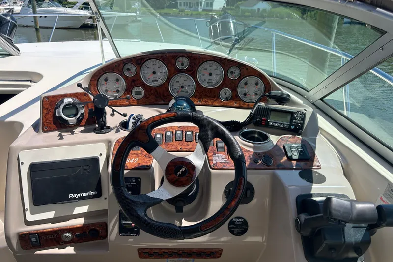 Slide: The Image of Cockpit of 2006 Rinker Fiesta Vee 342 boat with steering wheel and navigation instruments. - 3