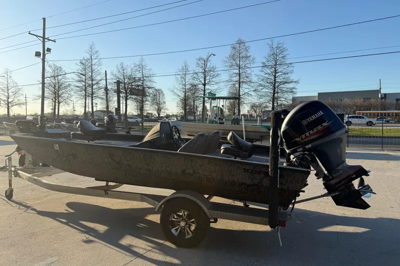 Slide: The Image of 2019 Xpress XP7 boat with Yamaha engine on trailer, parked outdoors. - 3