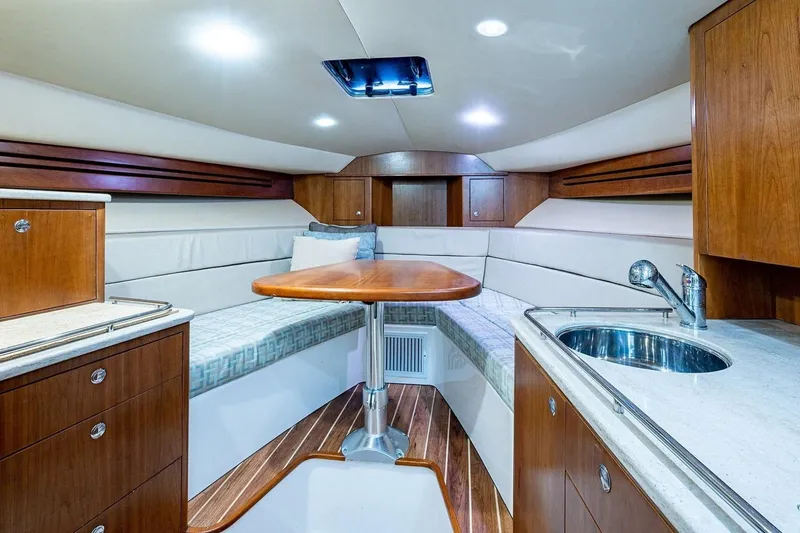 Slide: The Image of Luxurious interior of 2012 Brooks Boatworks 34, featuring wood cabinetry and modern amenities. - 10