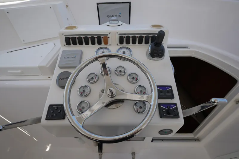 Slide: The Image of Steering console of 2012 Custom Carolina 34 boat with Garmin navigation system. - 17
