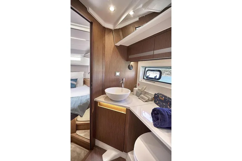 Slide: The Image of Manufacturer Provided Image: Luxurious bathroom interior of 2026 Beneteau Antares 12 Coupe yacht, featuring modern amenities. - 12