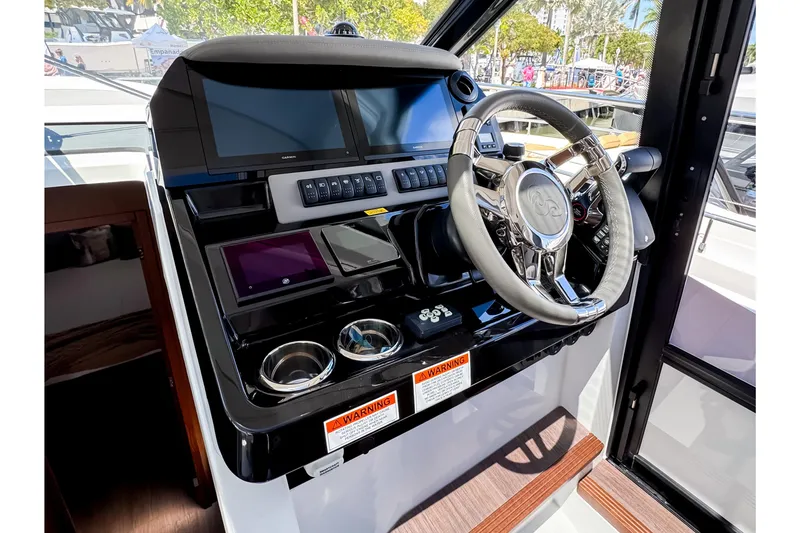 Slide: The Image of Helm of 2026 Beneteau Antares 12 Coupe with modern instruments. - 16