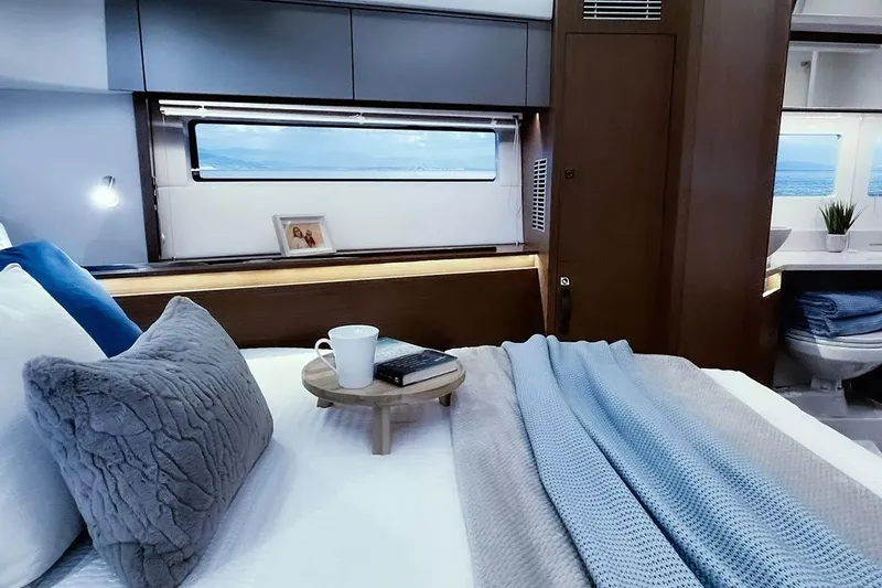 Slide: The Image of Luxurious bedroom in Beneteau Antares 12 Coupe 2026 yacht. - 18