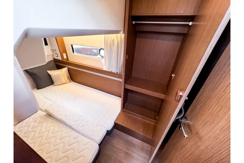Slide: The Image of Interior of 2026 Beneteau Antares 12 Coupe with bed and wardrobe. - 22