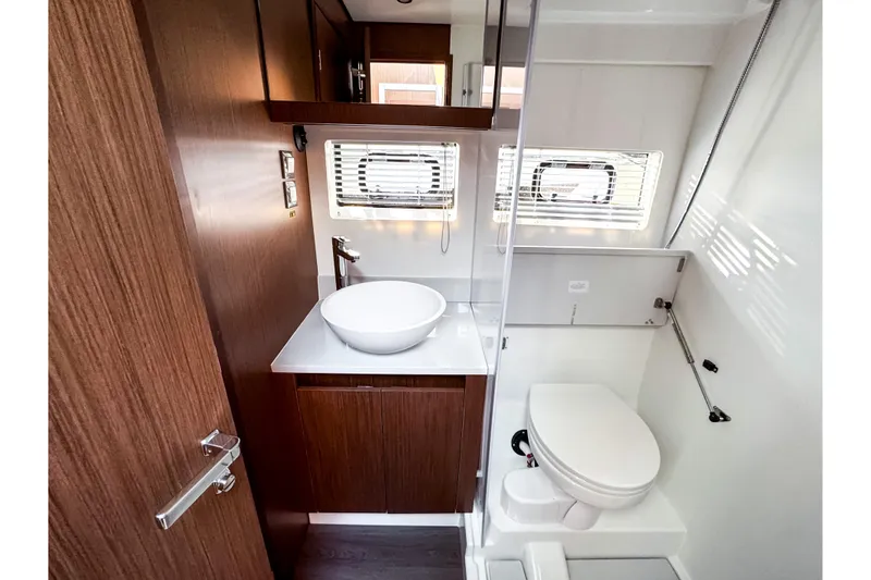 Slide: The Image of Interior view of 2026 Beneteau Antares 12 Coupe bathroom. - 24
