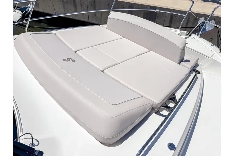 Slide: The Image of 2026 Beneteau Antares 12 Coupe sunbed on deck. - 29