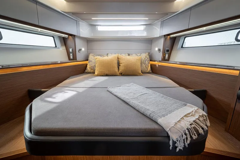 Slide: The Image of Manufacturer Provided Image: Luxurious cabin interior of 2026 Beneteau Antares 12 Coupe with cozy bedding. - 8