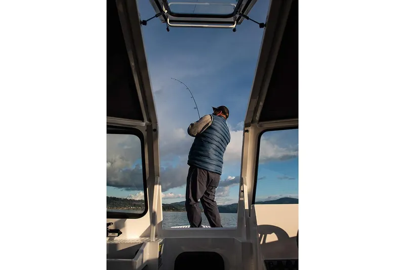 Slide: The Image of Manufacturer Provided Image: Angler on Duckworth 21 Discovery boat fishing, 2026 model. - 1