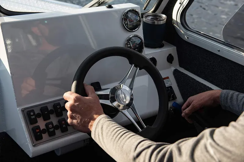 Slide: The Image of Manufacturer Provided Image: Steering console of a 2026 Duckworth 21 Discovery boat. - 2