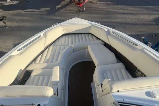 Slide: The Image of Bow seating area of a 2015 Cobalt R5 boat with white upholstery. - 10
