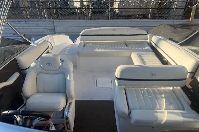 Slide: The Image of 2015 Cobalt R5 boat interior with white leather seating and steering wheel. - 11