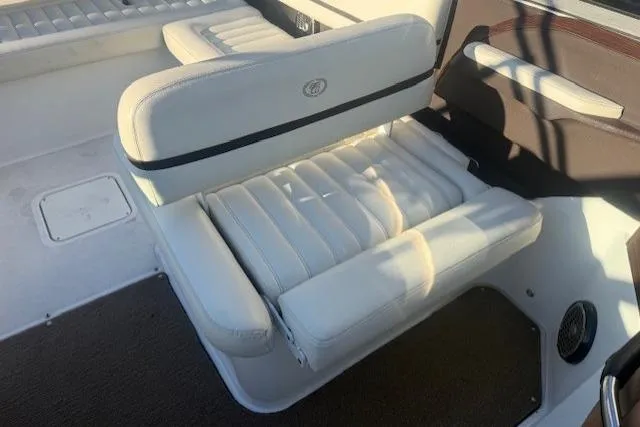 Slide: The Image of White leather seating in a 2015 Cobalt R5 boat interior. - 12