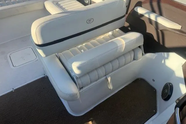 Slide: The Image of 2015 Cobalt R5 boat interior with white leather seating and brown accents. - 13