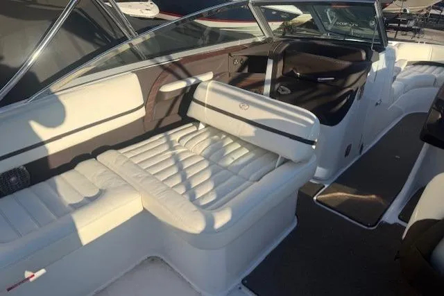 Slide: The Image of 2015 Cobalt R5 boat interior with white leather seating and sleek design. - 16