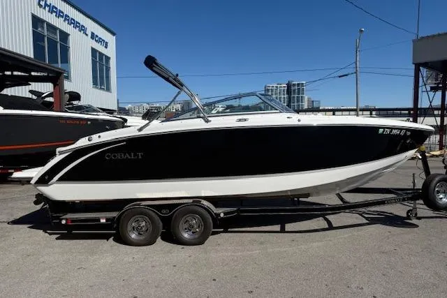 Slide: The Image of 2015 Cobalt R5 boat on trailer, parked outside Chaparral Boats dealership. - 2
