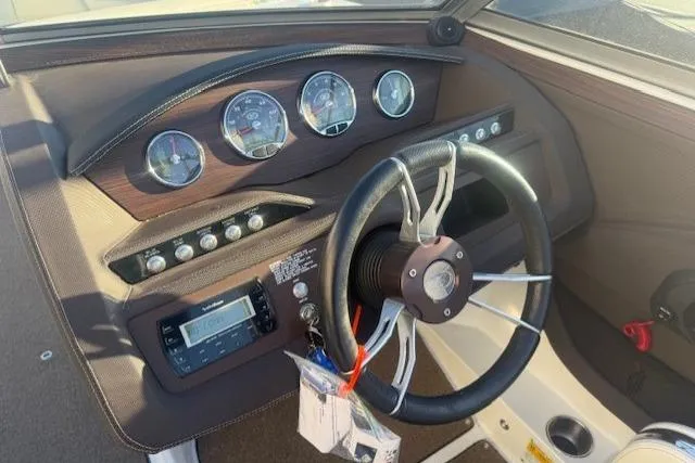 Slide: The Image of Dashboard of a 2015 Cobalt R5 boat with steering wheel and gauges. - 21