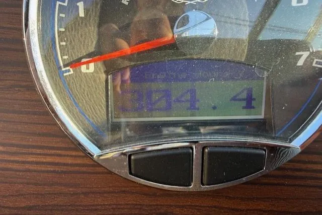 Slide: The Image of Close-up of a 2015 Cobalt R5 speedometer displaying 304.4 hours. - 22