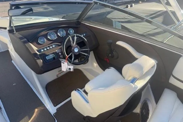 Slide: The Image of 2015 Cobalt R5 boat interior with steering wheel and dashboard controls. - 23