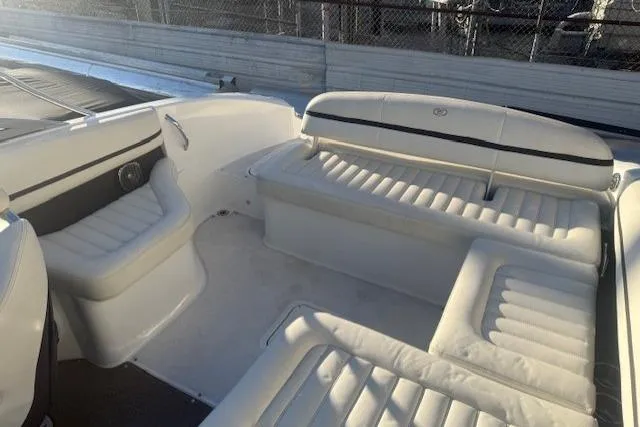 Slide: The Image of 2015 Cobalt R5 boat interior with white leather seating and sleek design. - 24