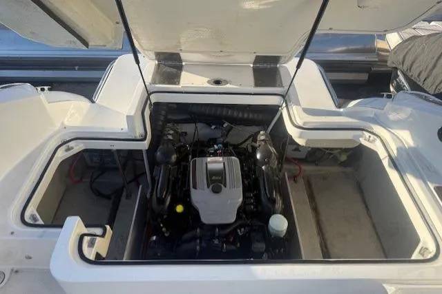 Slide: The Image of Open engine compartment of a 2015 Cobalt R5 boat, showcasing the engine details. - 25