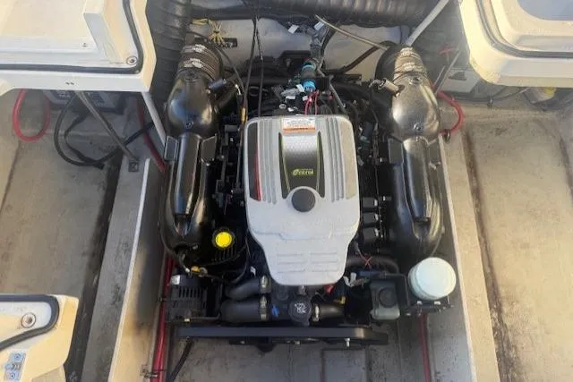 Slide: The Image of Engine compartment of a 2015 Cobalt R5 boat, showcasing detailed mechanical components. - 26