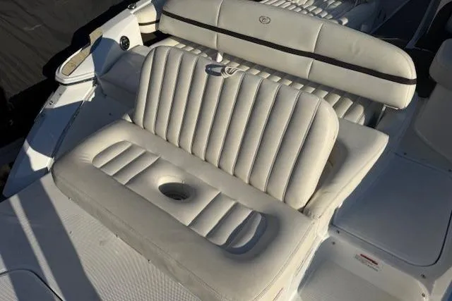 Slide: The Image of 2015 Cobalt R5 boat with white leather seating and cup holder. - 29