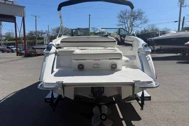 Slide: The Image of 2015 Cobalt R5 boat, rear view, in a marina setting. - 4
