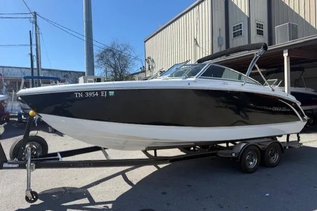 Slide: The Image of 2015 Cobalt R5 boat on trailer, parked outside a building. - 7