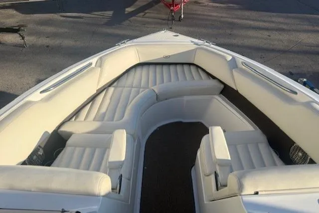 Slide: The Image of Bow seating area of a 2015 Cobalt R5 boat with white upholstery. - 9