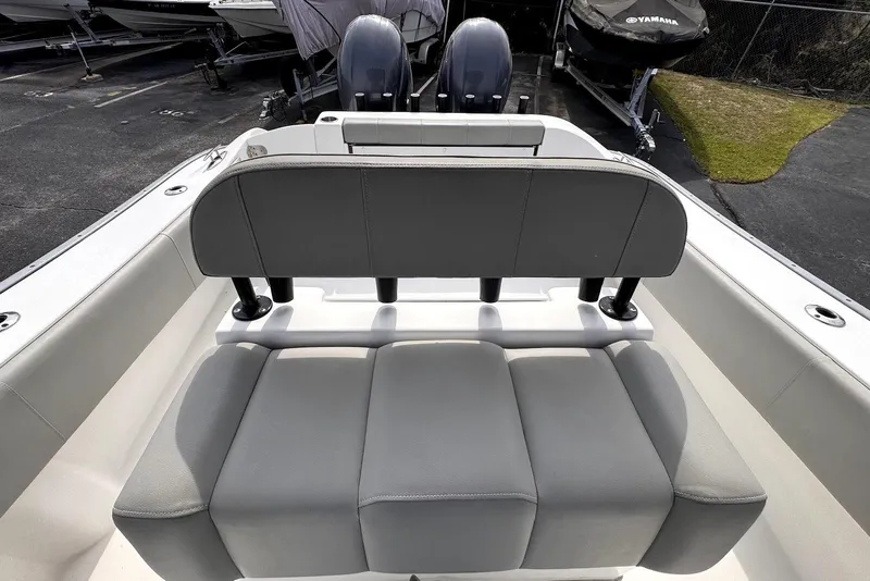 Slide: The Image of 2020 Cape Horn 27 XS boat interior with cushioned seating and dual engines. - 12