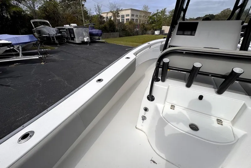 Slide: The Image of 2020 Cape Horn 27 XS boat interior with rod holders and storage compartment. - 18