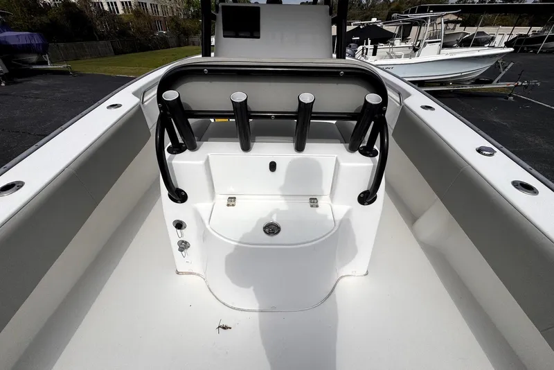 Slide: The Image of 2020 Cape Horn 27 XS boat interior with rod holders and storage compartment. - 19