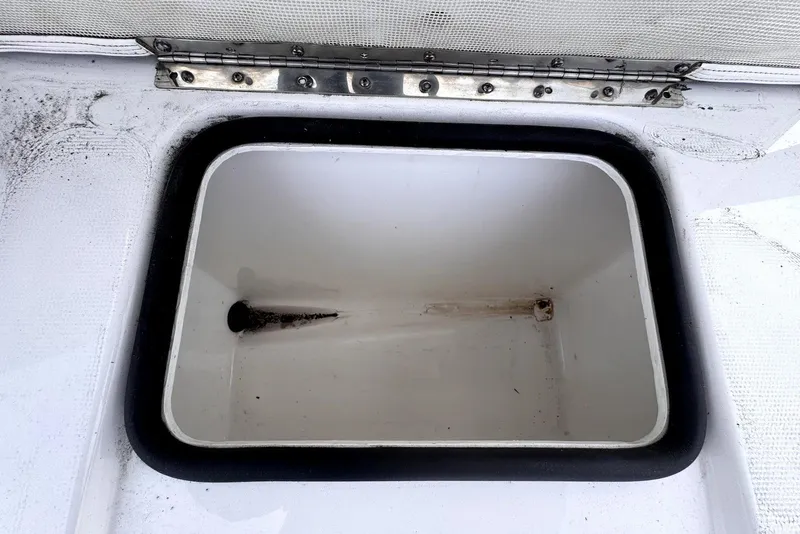 Slide: The Image of Open storage compartment on a 2020 Cape Horn 27 XS boat. - 27
