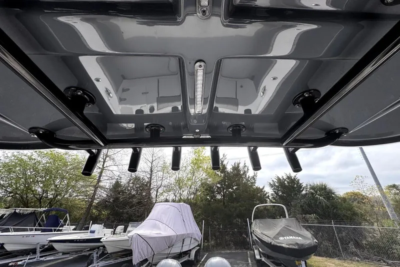 Slide: The Image of 2020 Cape Horn 27 XS boat with rod holders and covered boats in background. - 28