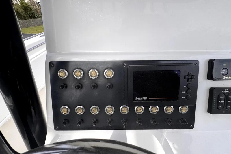 Slide: The Image of Control panel of a 2020 Cape Horn 27 XS boat with Yamaha display and switches. - 37